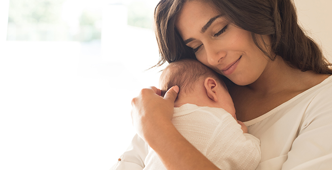 mother holding baby