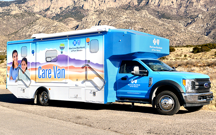 the Blue Cross Blue Shield care van in front of a hill on a sunny afternoon