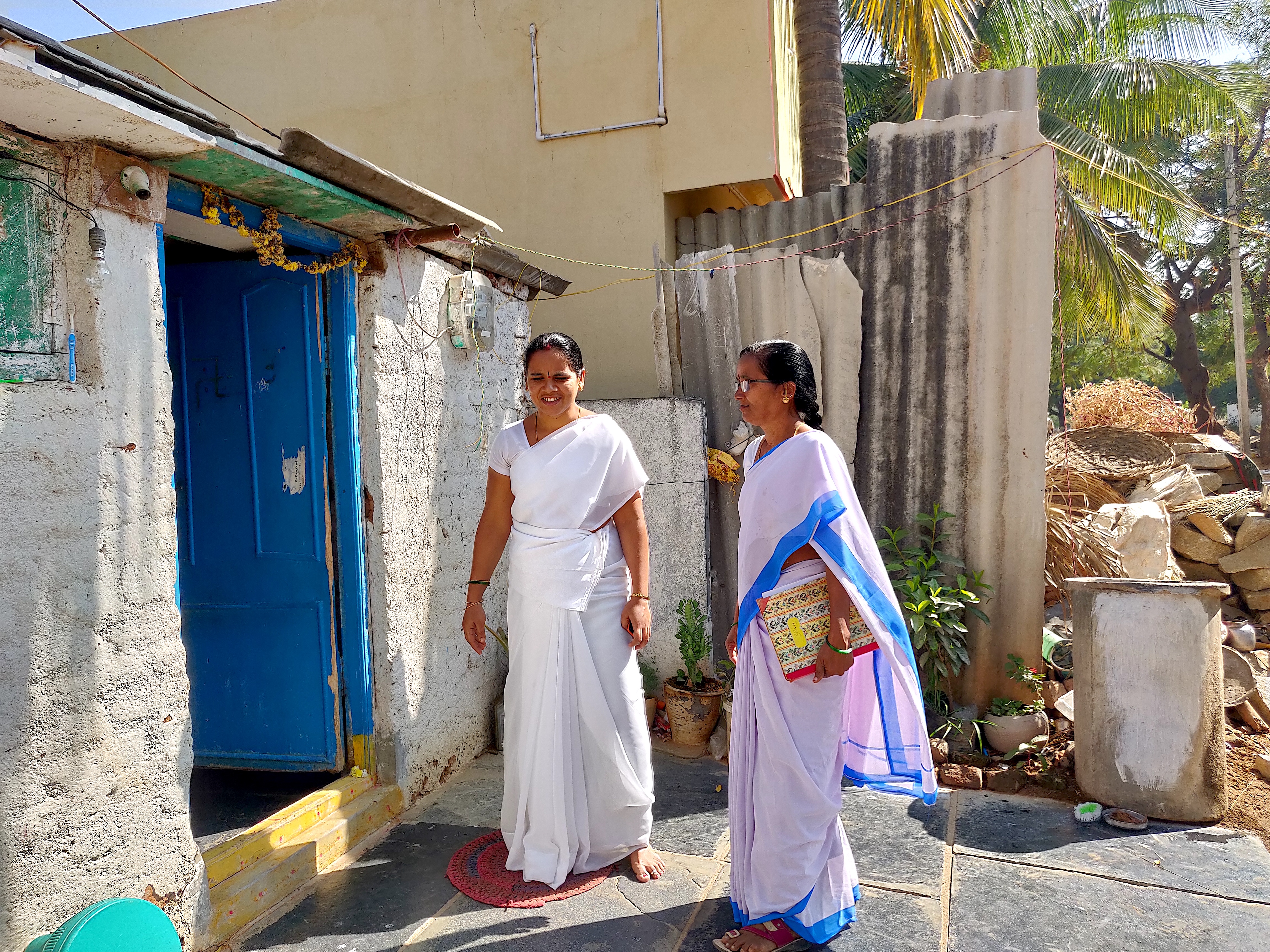 Health care workers in India go door to door during the COVID-19 pandemic