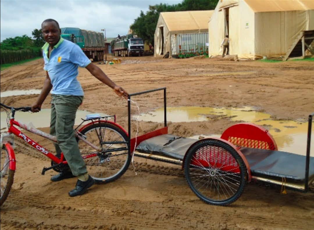 Dr. Bonaventure Ahaisibwe rides a bike ambulance in Africa 