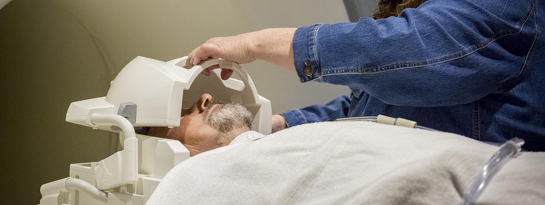 A person being prepared to be put in a MRI