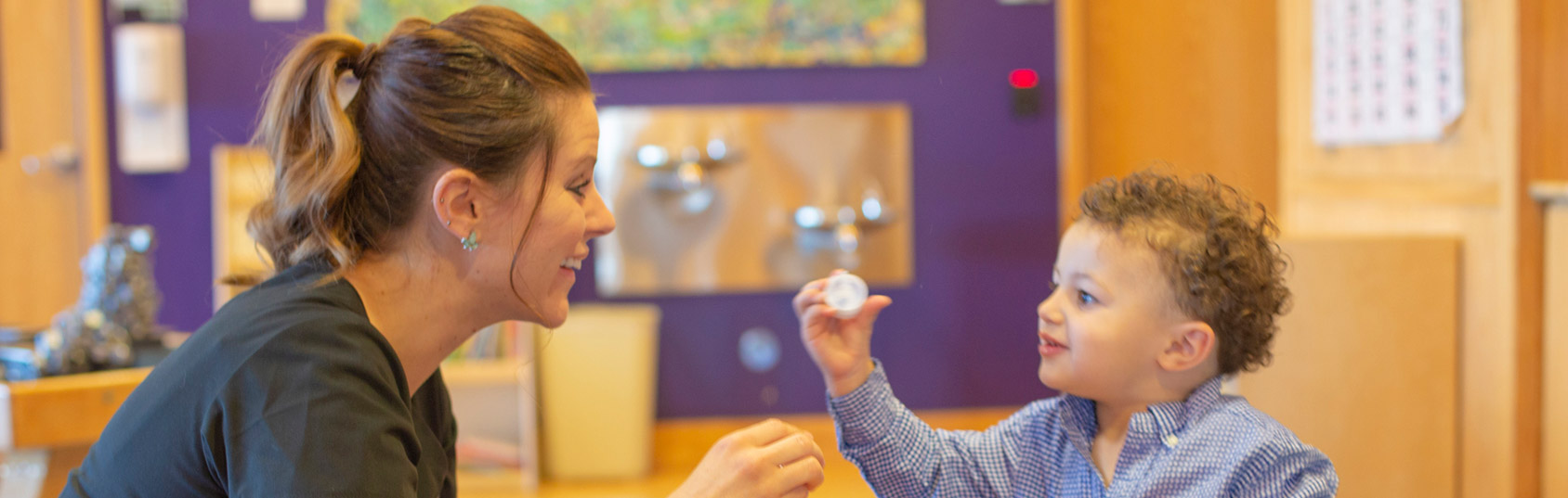 A health care professional with a child patient