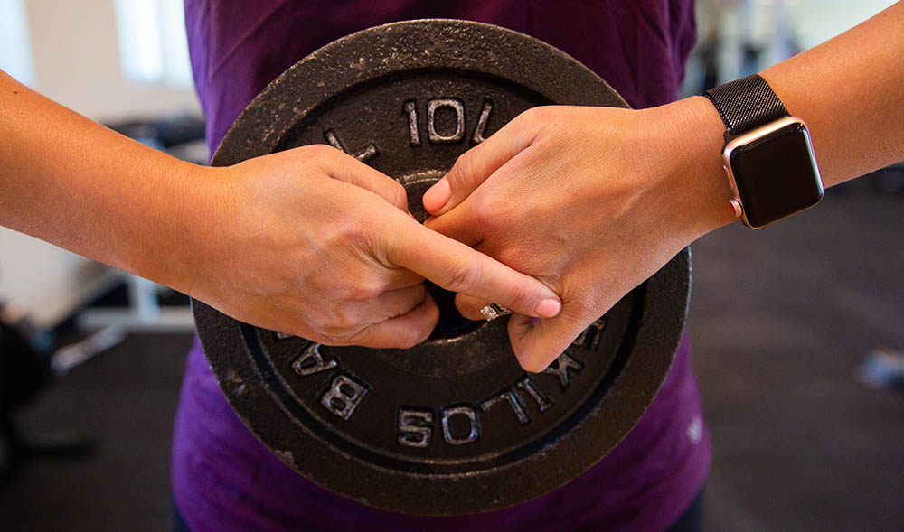 Mother exercising using weight