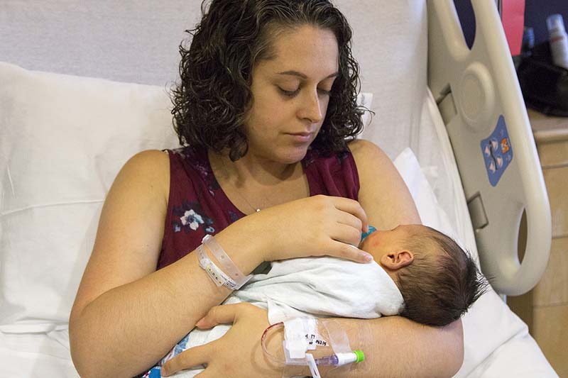 A mother holding her newborn