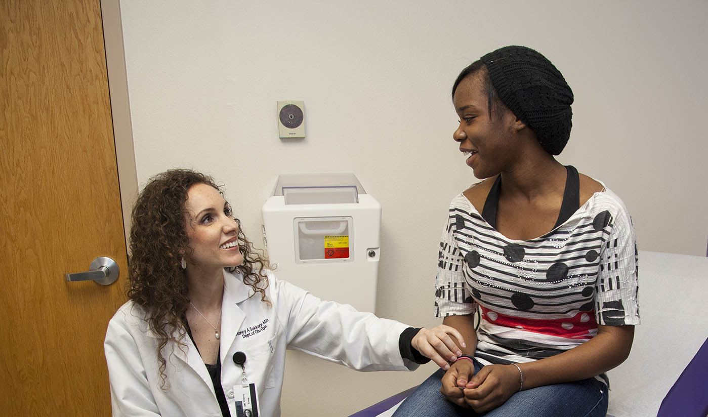 An OB/GYN talking to a patient