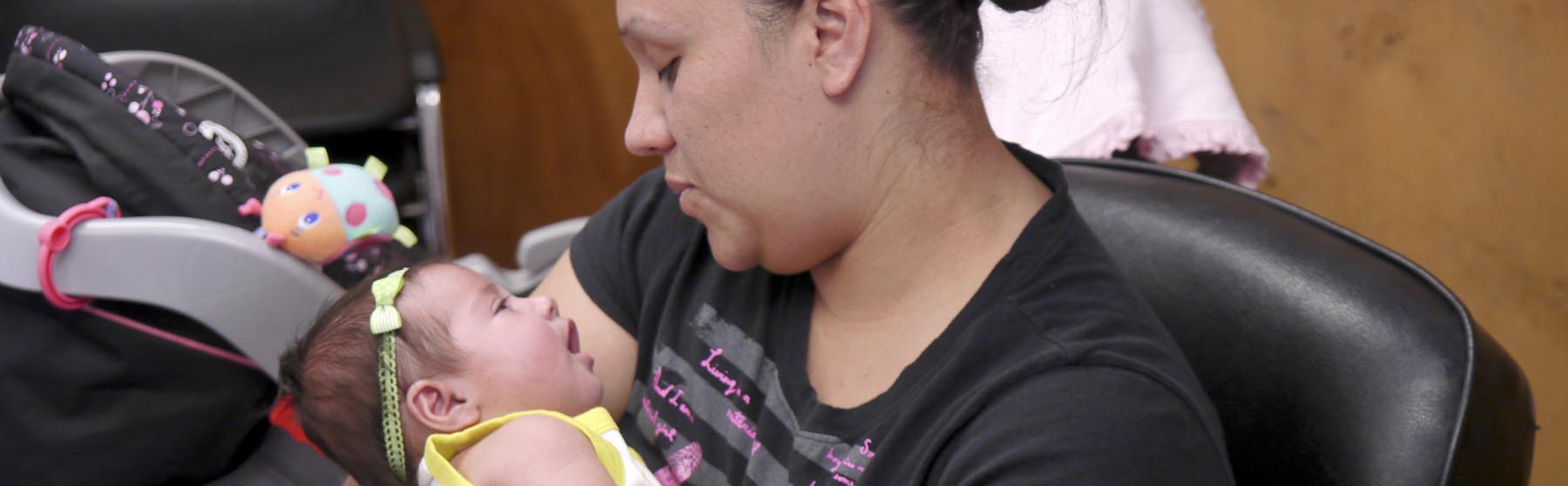 A mother holding her baby