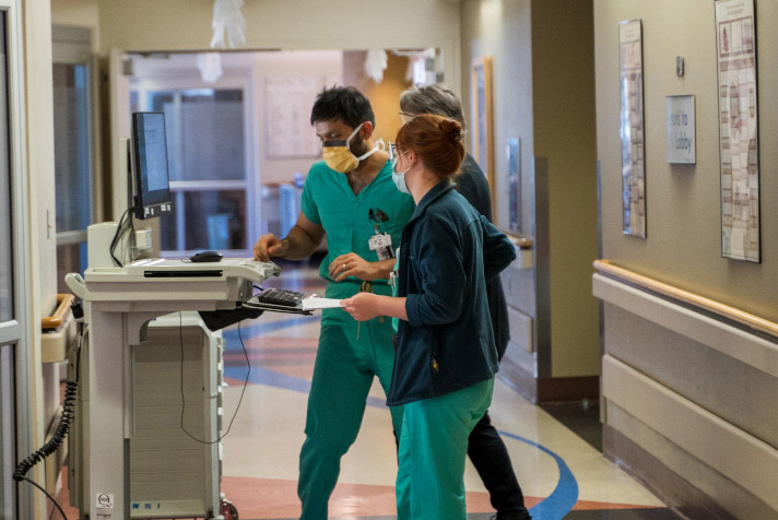 Critical care team working on a patient.